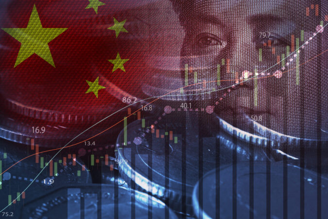 Double exposure of Mao Tse Tung from Yuan banknote and coins with stock market chart for China economy growth and investment trading concept.